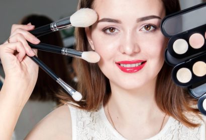 makeup-artist-with-brushes-hand-white-background_553815-300